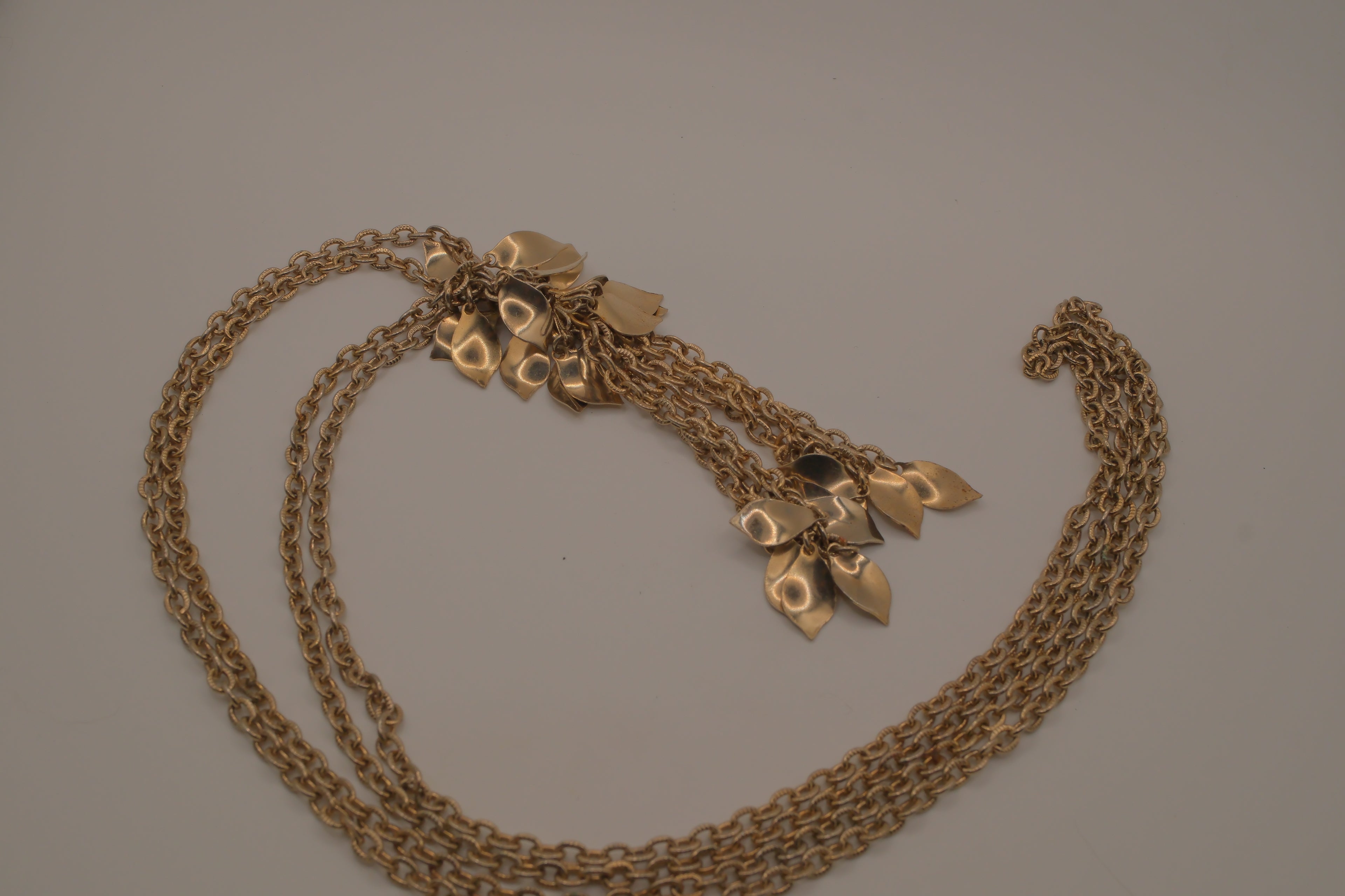 Vintage gold-tone multi-strand leaf and flower tassel necklace