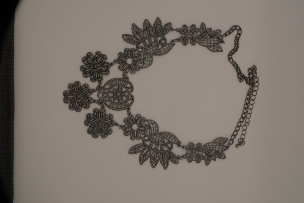 Black filigree bib statement necklace