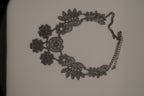 Black filigree bib statement necklace