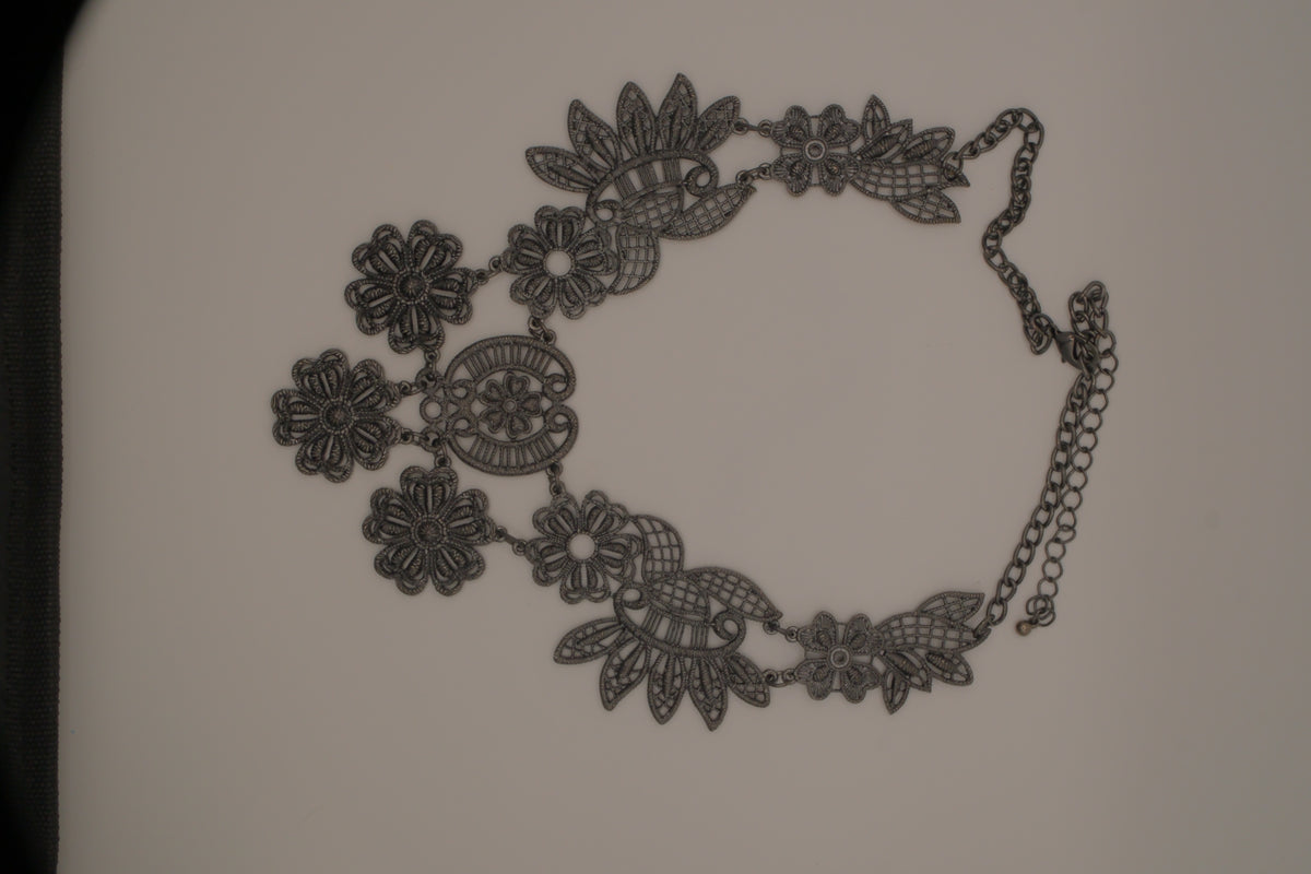 Black filigree bib statement necklace