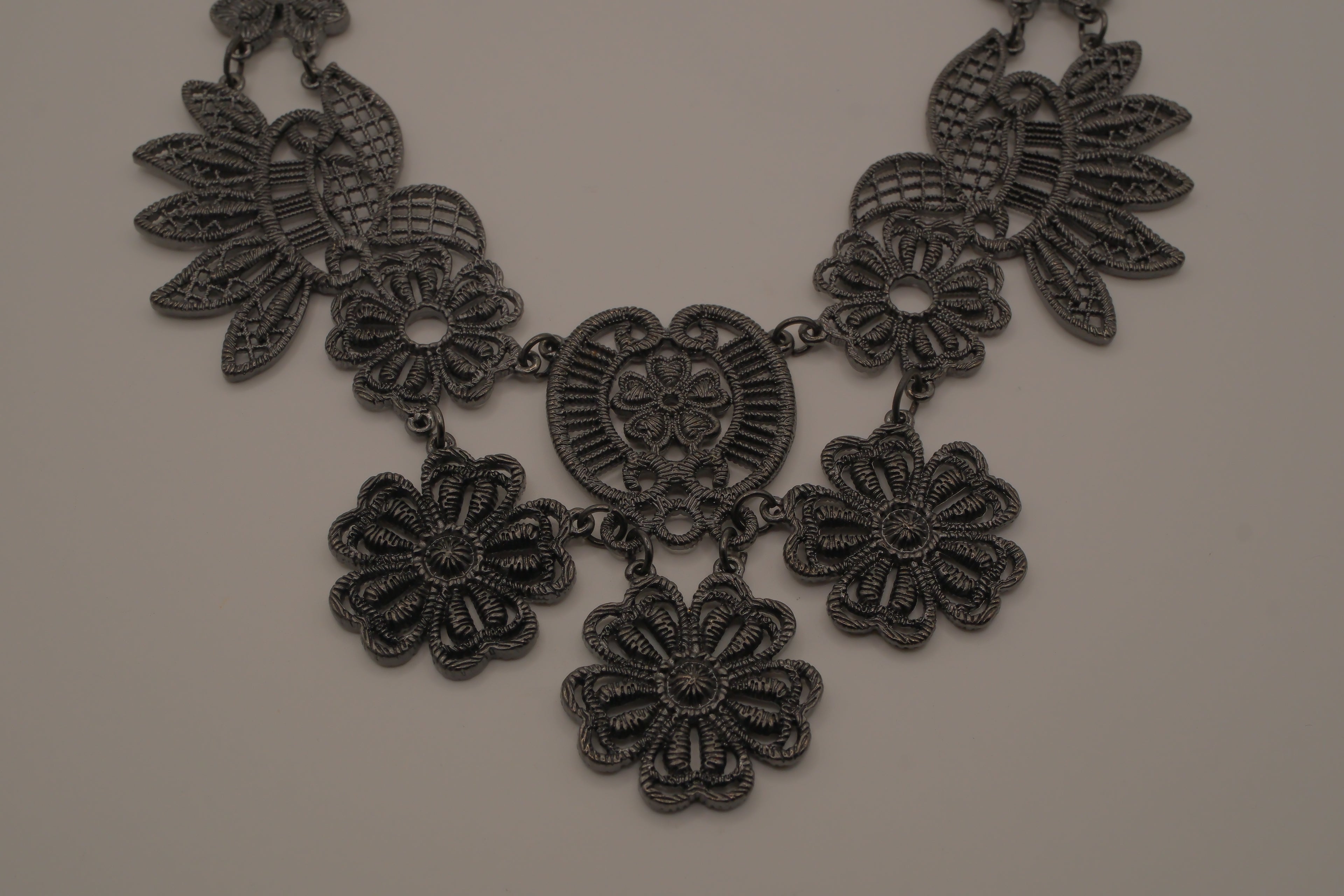 Black filigree bib statement necklace