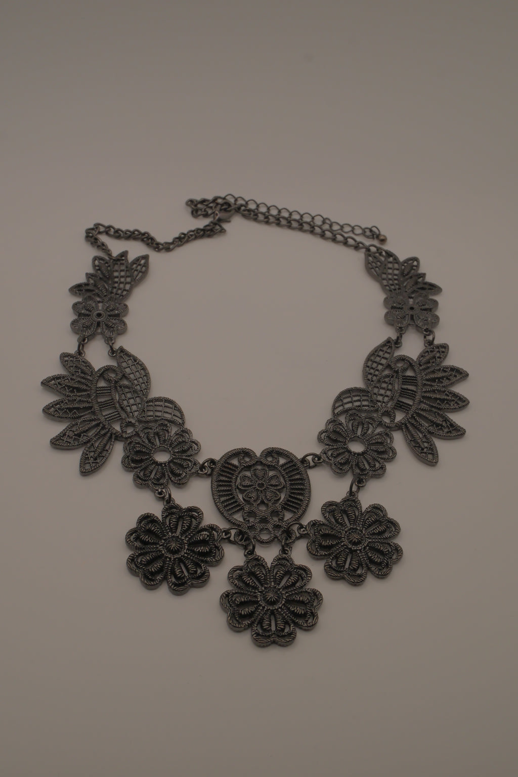 Black filigree bib statement necklace
