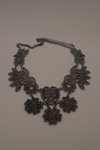 Black filigree bib statement necklace