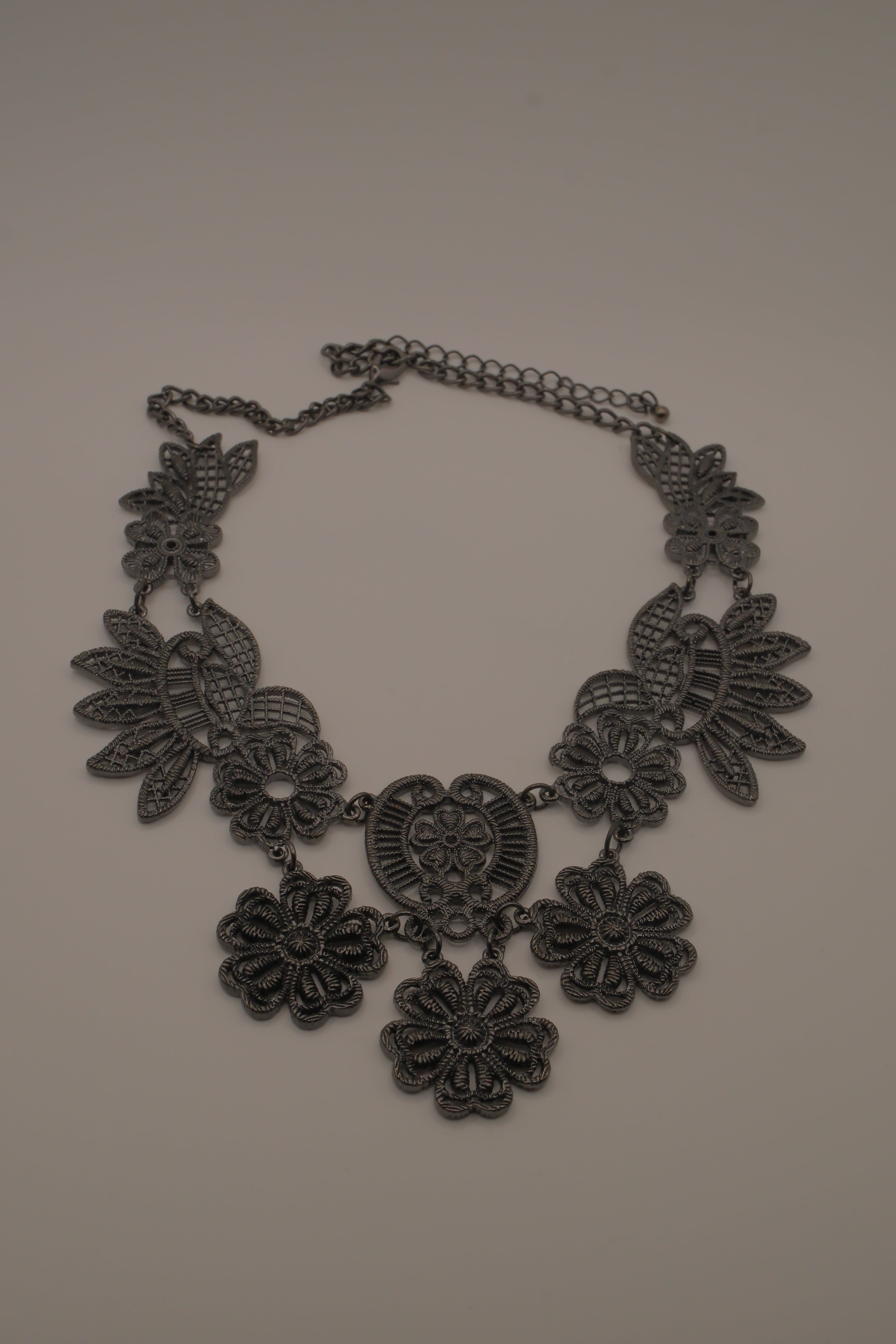 Black filigree bib statement necklace