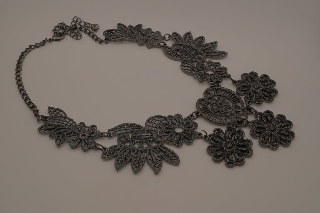 Black filigree bib statement necklace