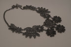 Black filigree bib statement necklace