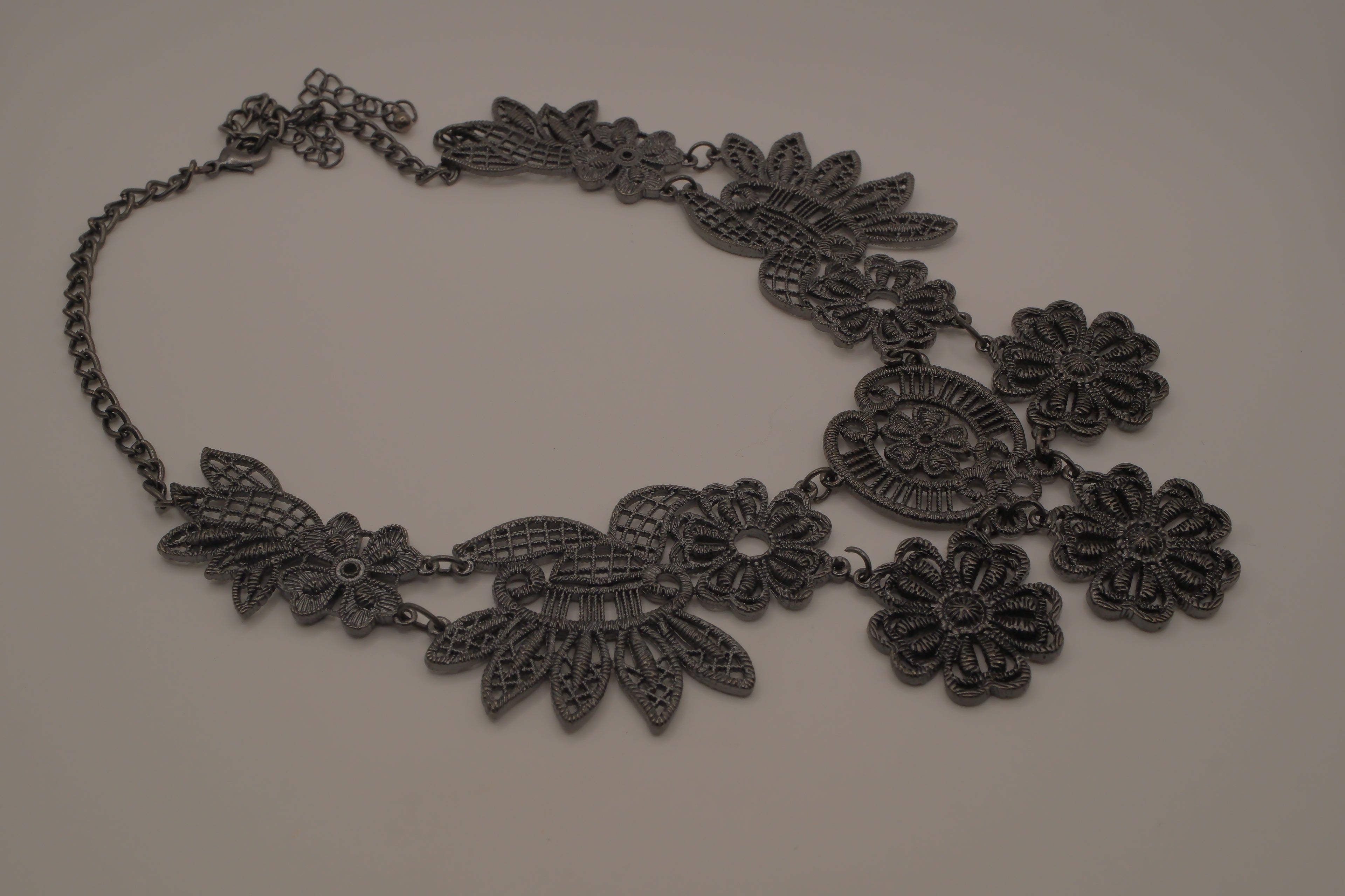 Black filigree bib statement necklace