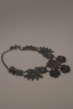 Black filigree bib statement necklace