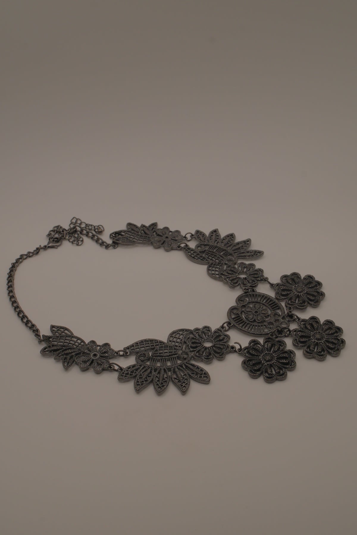 Black filigree bib statement necklace