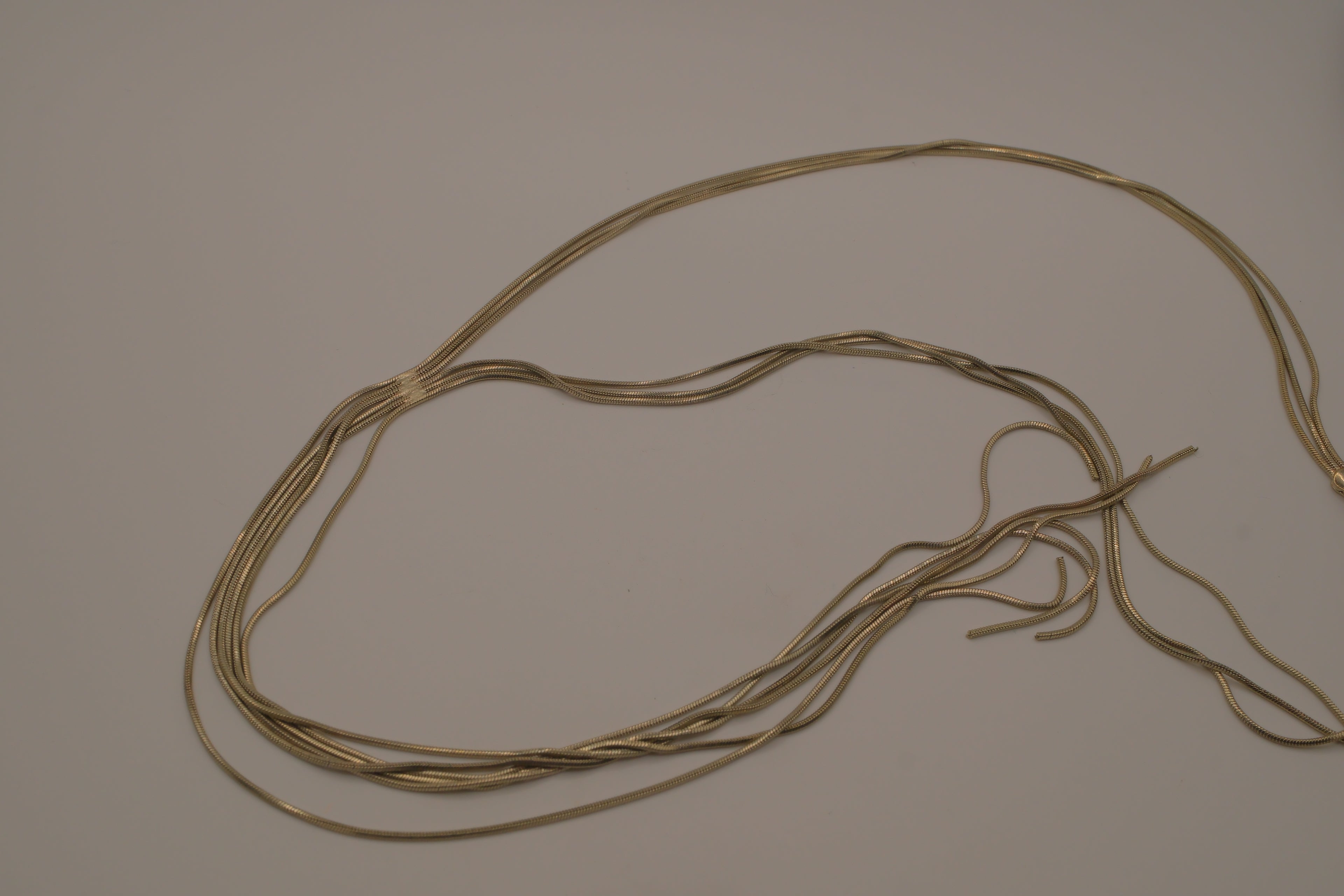 Multi-strand gold lariat necklace