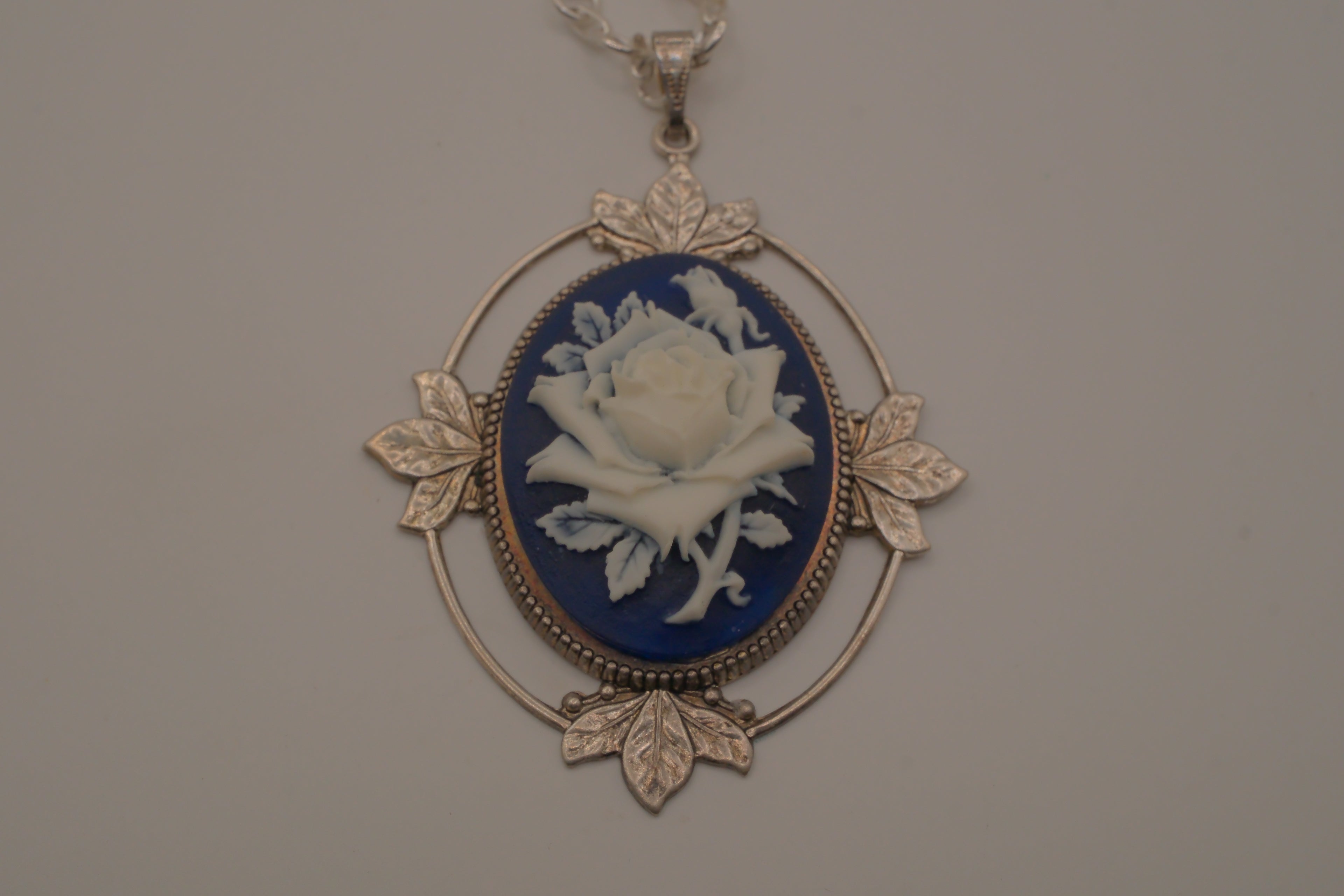 Victorian-style blue and white rose cameo pendant necklace