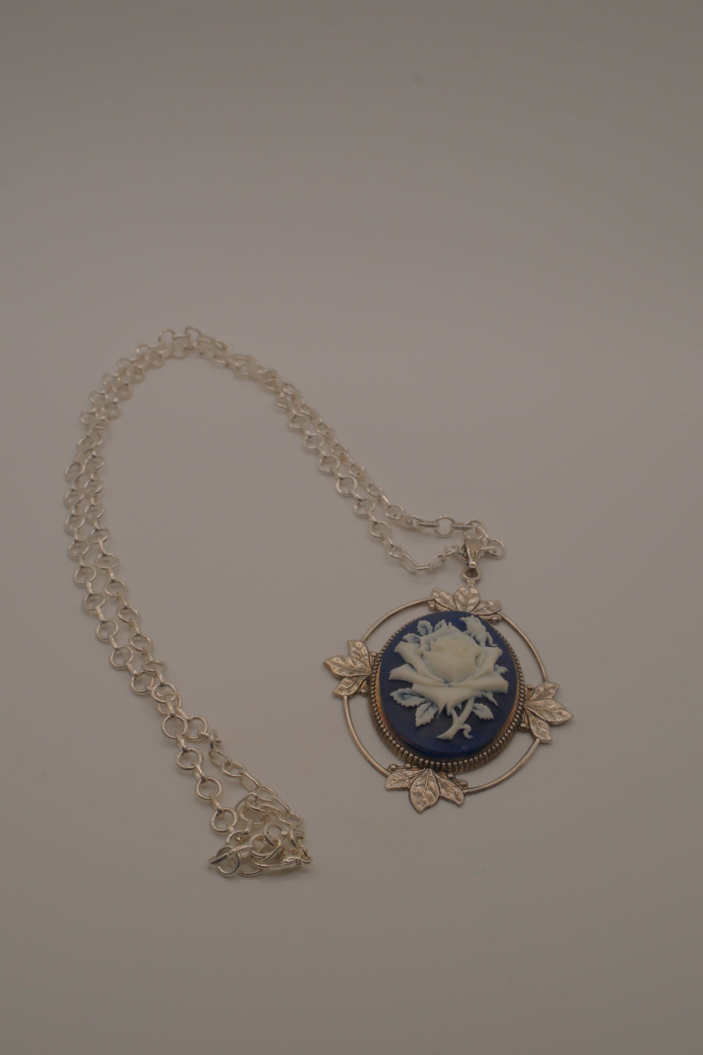 Victorian-style blue and white rose cameo pendant necklace