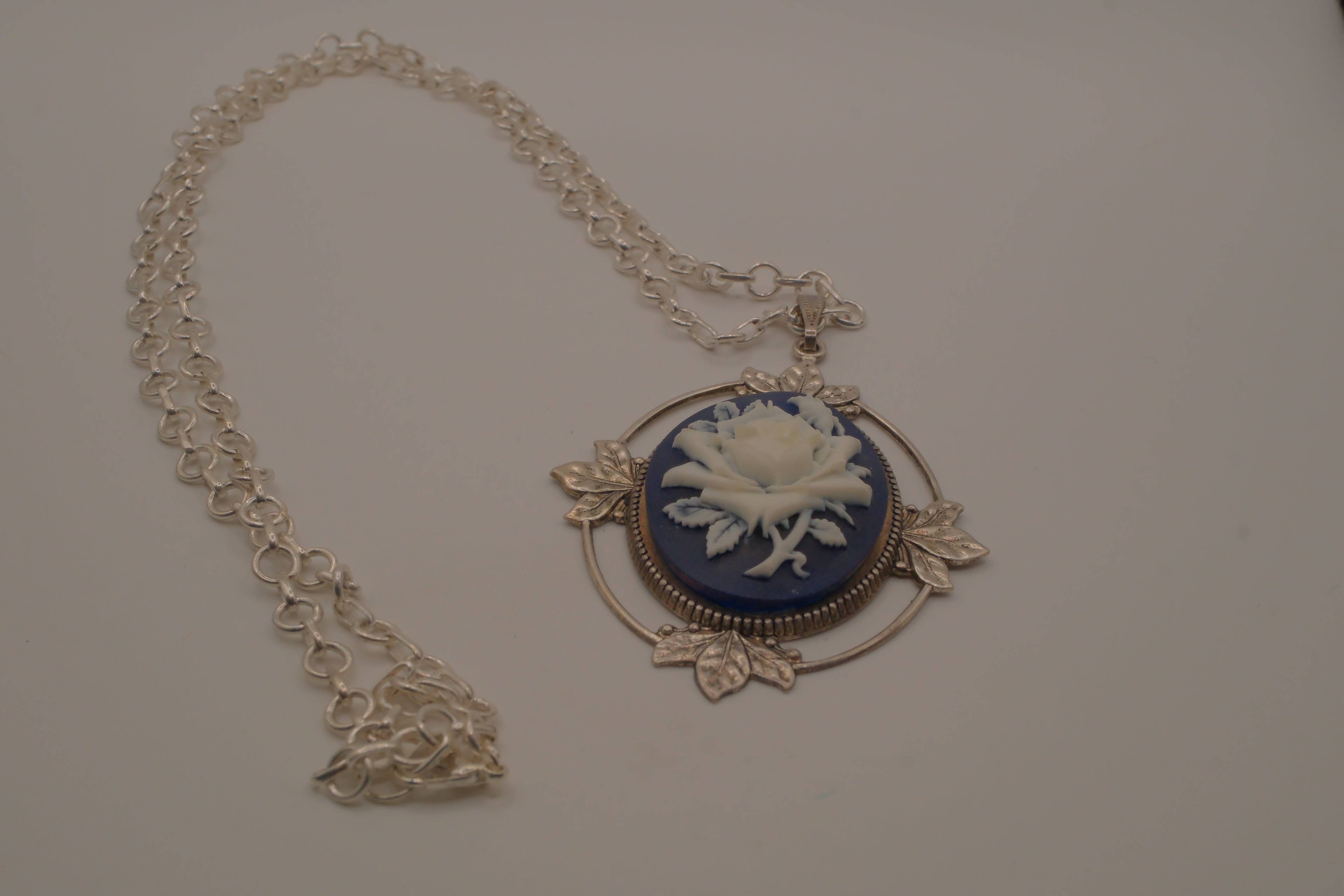 Victorian-style blue and white rose cameo pendant necklace