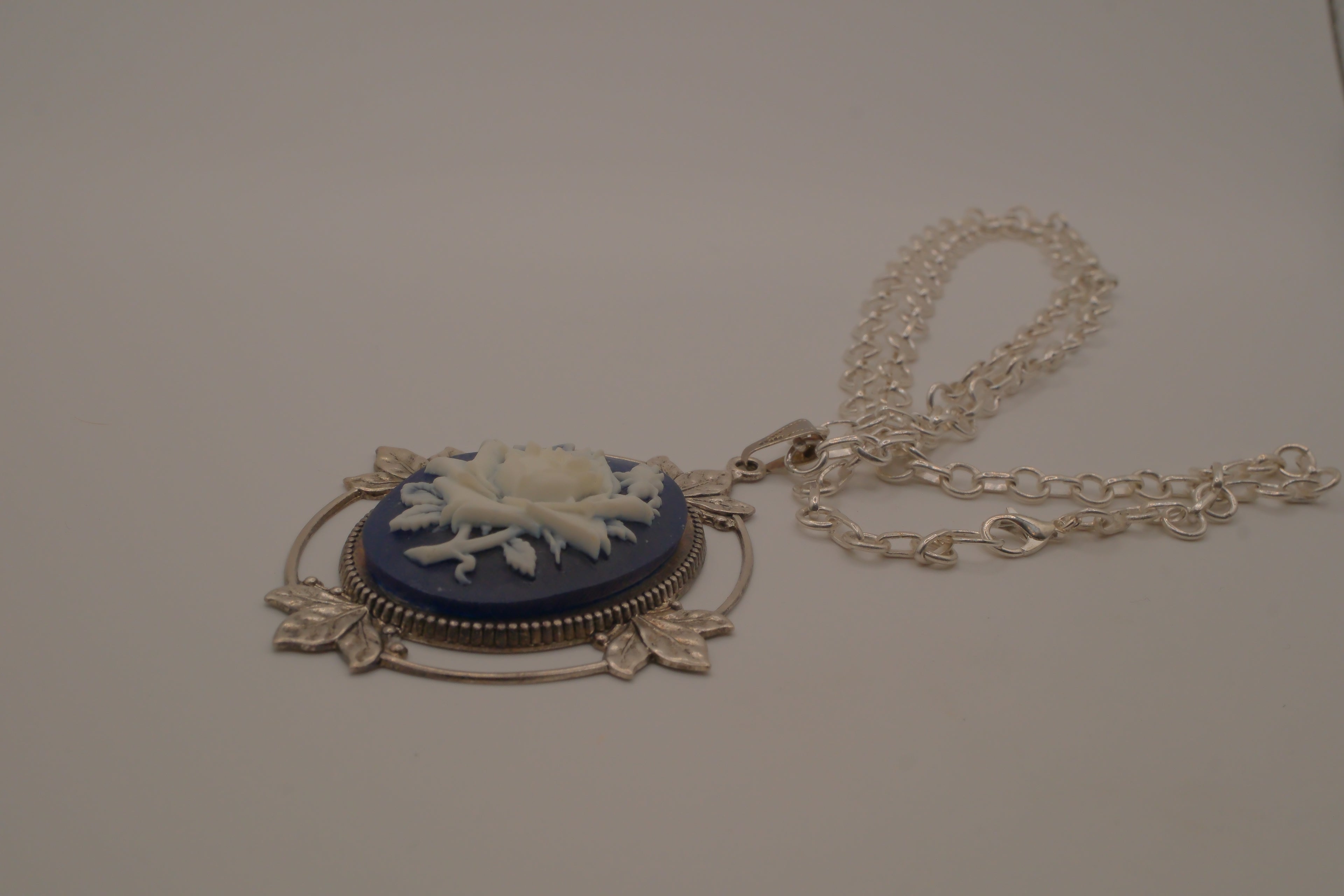 Victorian-style blue and white rose cameo pendant necklace