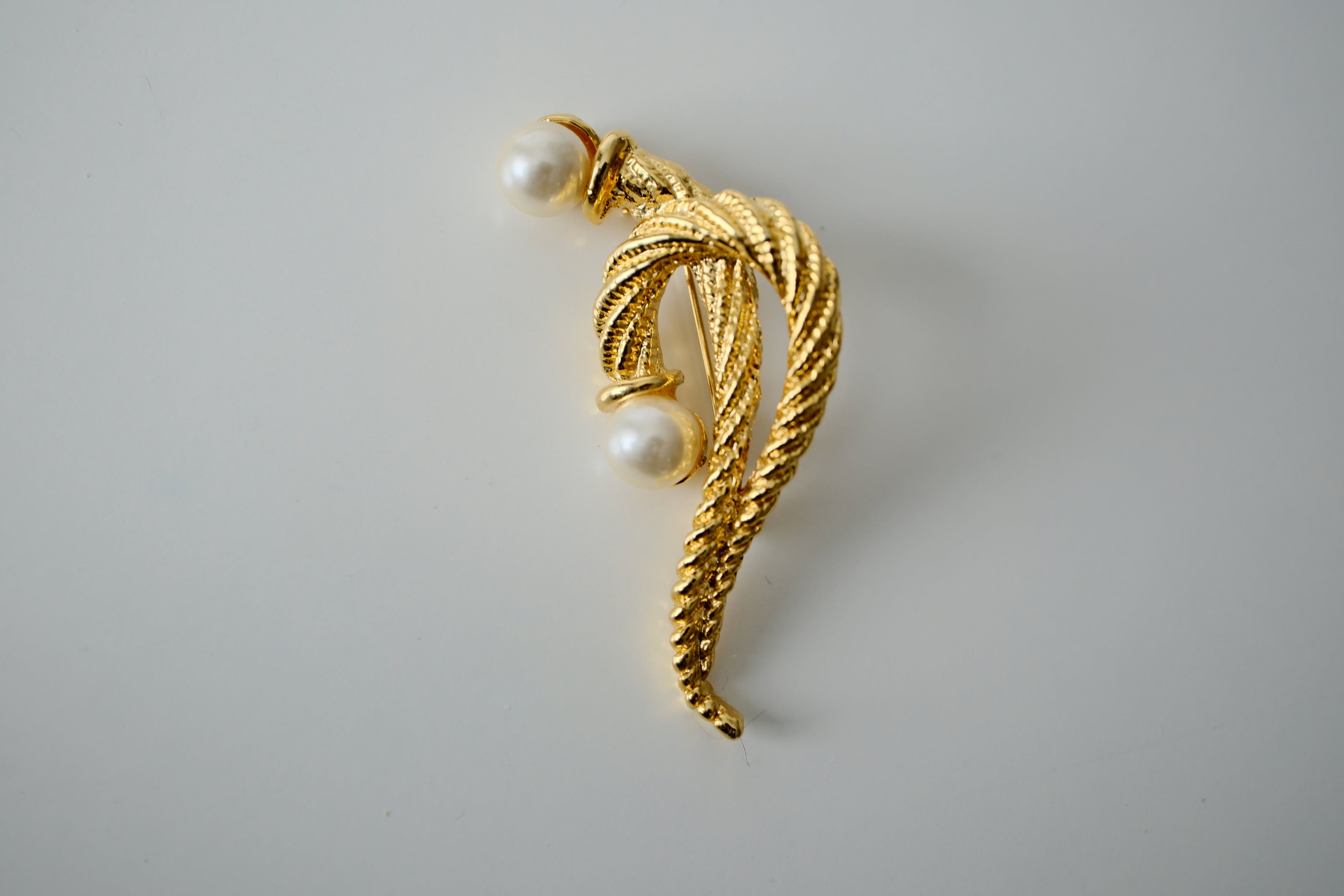 Vintage Christian Dior Brooch with a twisted rope design and two faux pearls