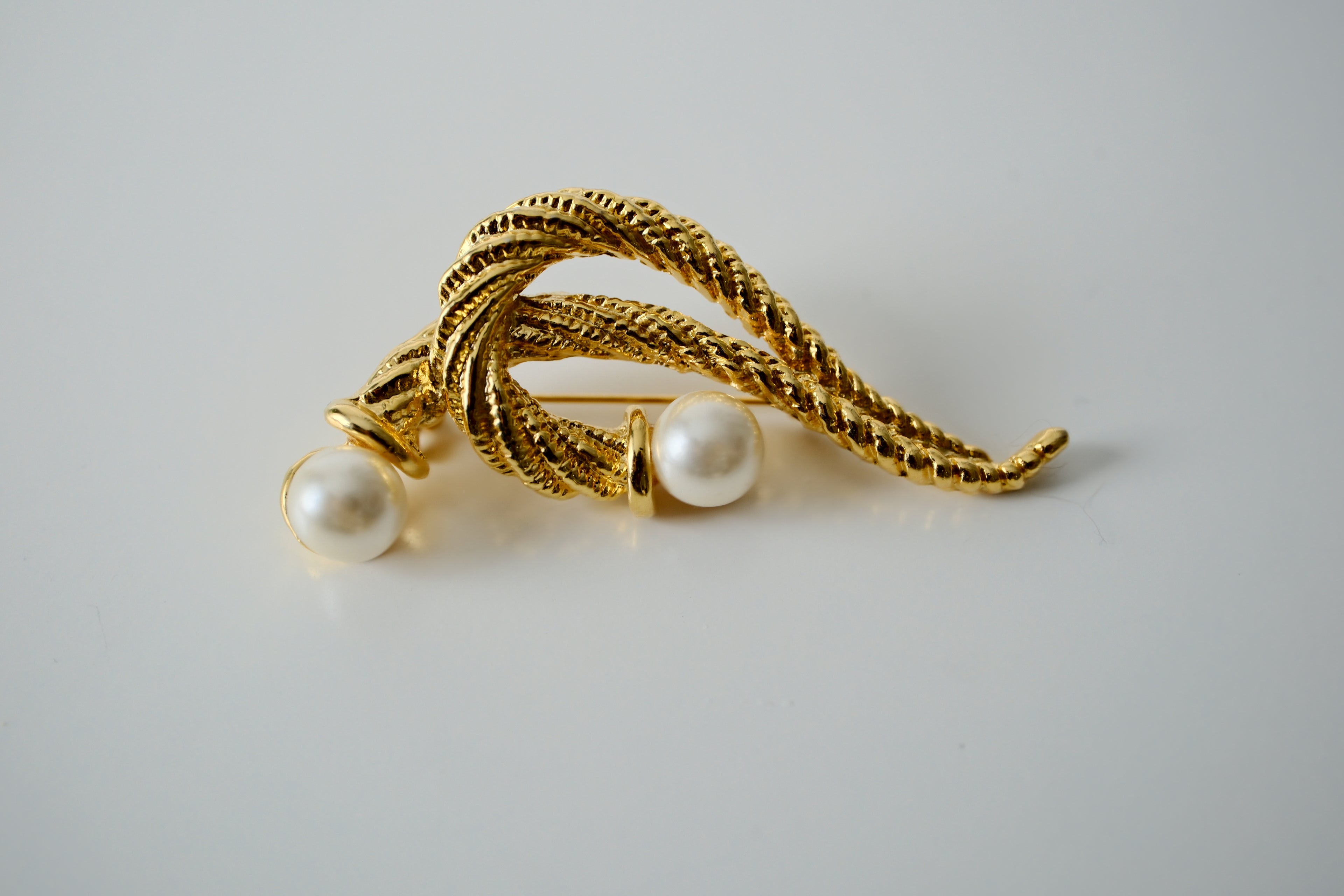 Vintage Christian Dior Brooch with a twisted rope design and two faux pearls