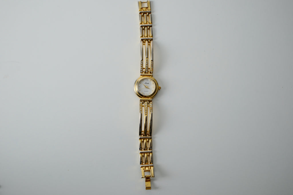 Vintage Minlin Gold Tone link watch with white rhinestones