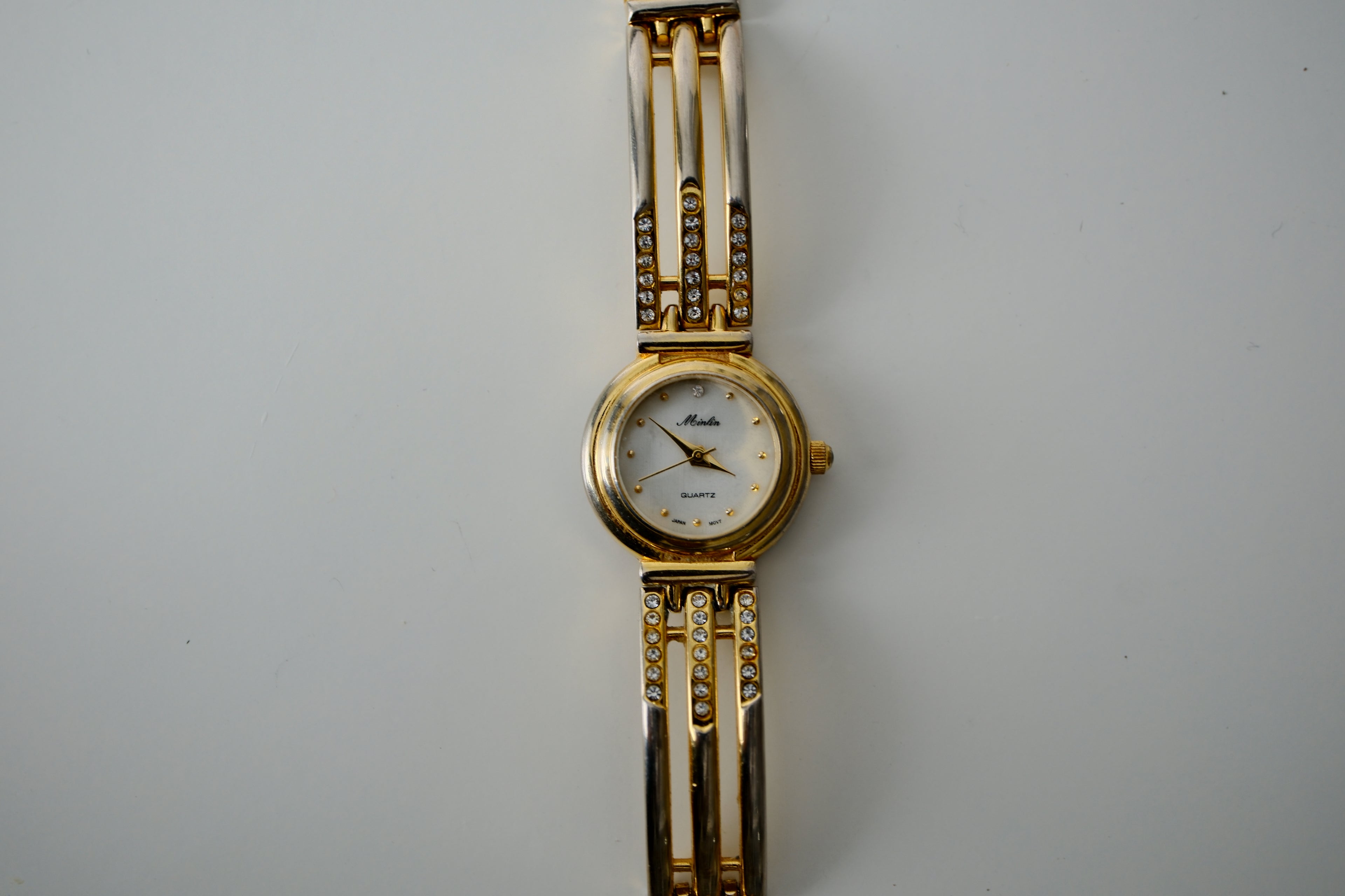 Vintage Minlin Gold Tone link watch with white rhinestones