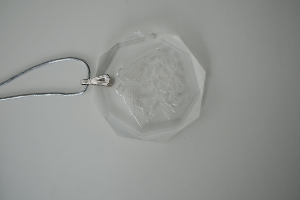 Sterling silver chain with an etched design of 2 birds