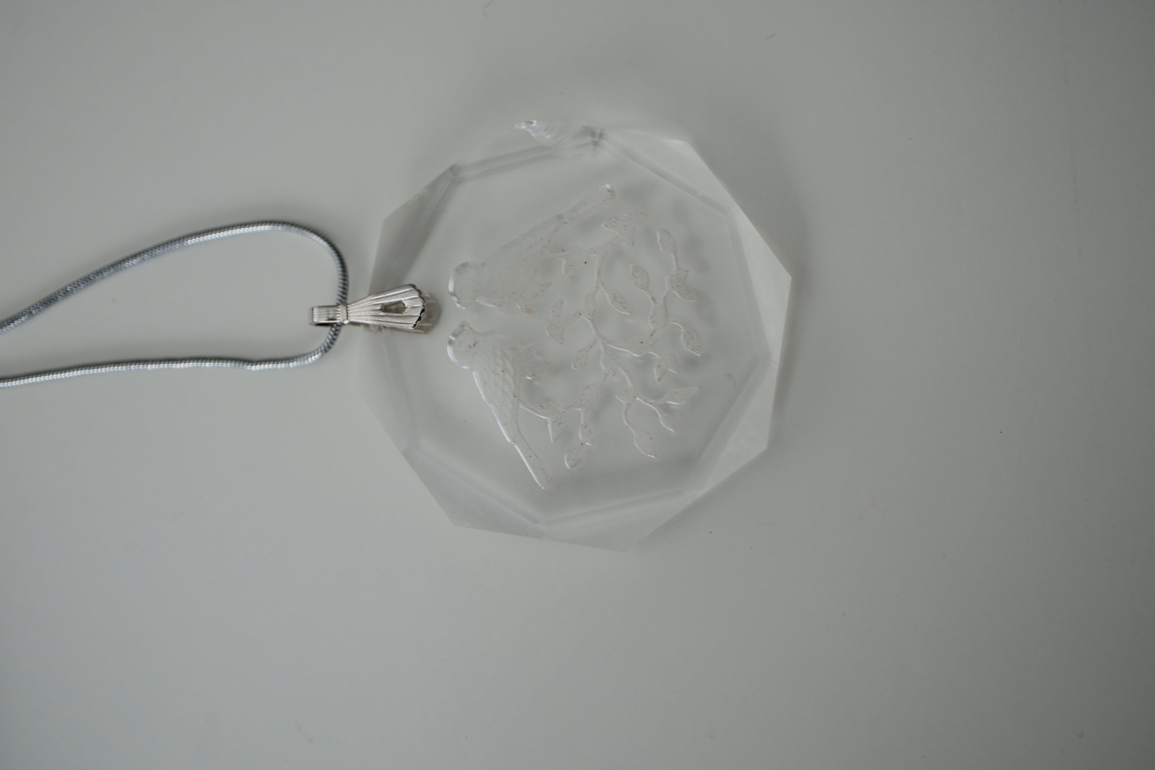 Sterling silver chain with an etched design of 2 birds