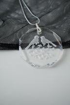 Sterling silver chain with an etched design of 2 birds