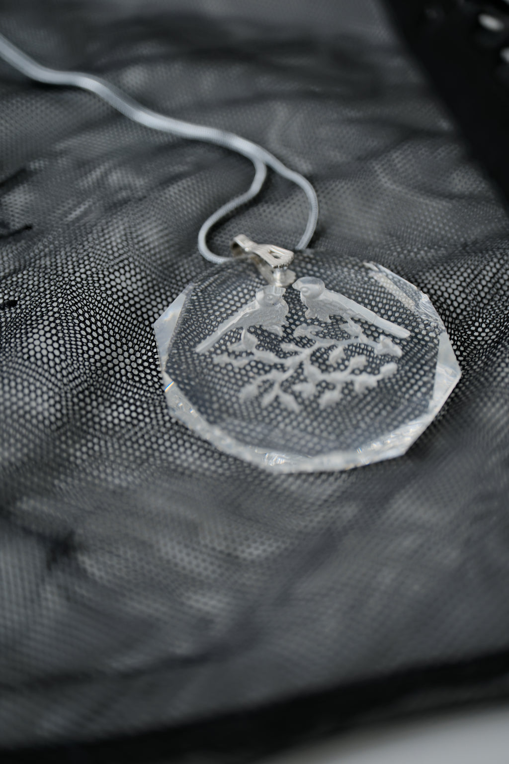 Sterling silver chain with an etched design of 2 birds
