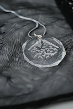 Sterling silver chain with an etched design of 2 birds