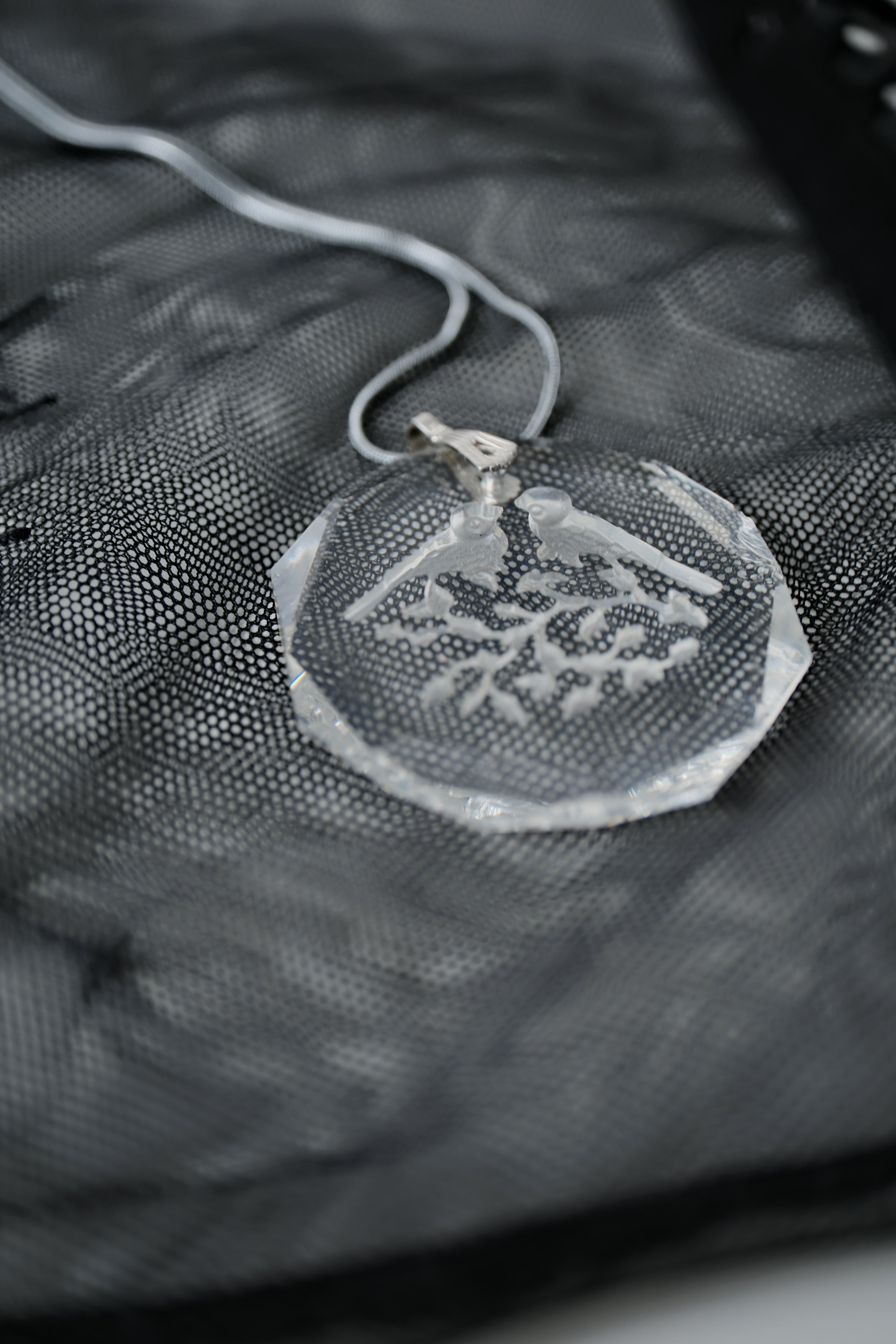 Sterling silver chain with an etched design of 2 birds