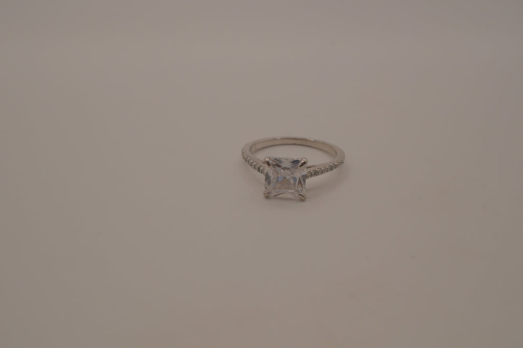 Sterling silver classic solitaire ring with a pavé-set band