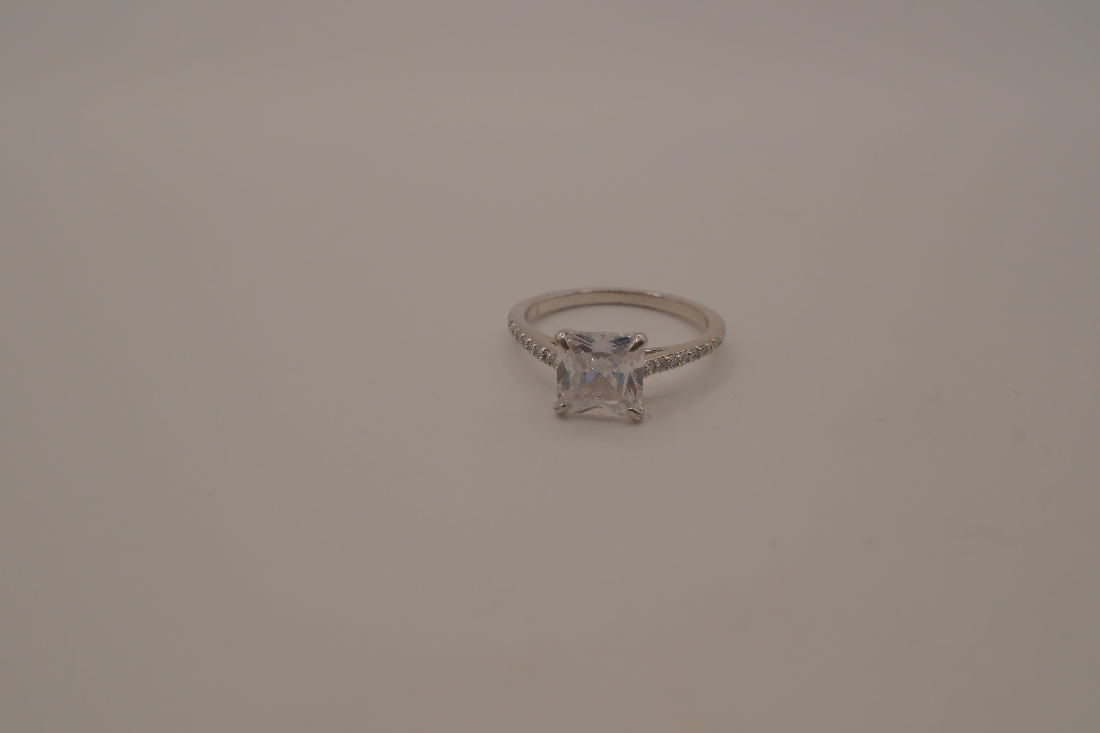 Sterling silver classic solitaire ring with a pavé-set band