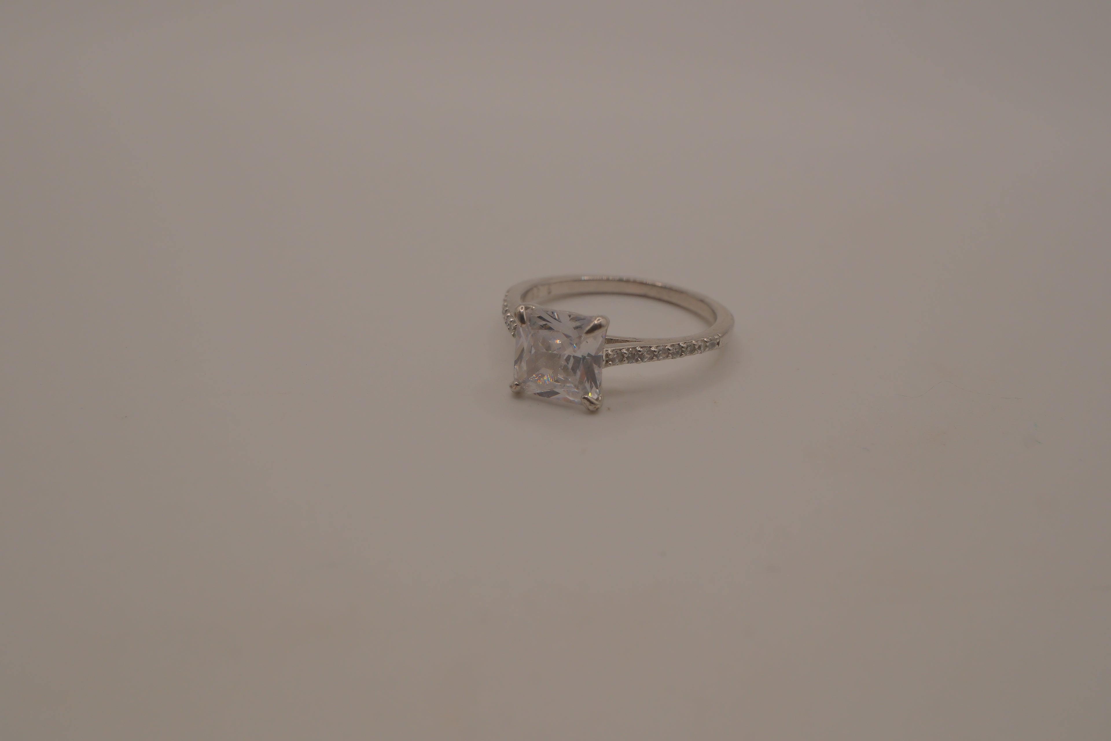 Sterling silver classic solitaire ring with a pavé-set band