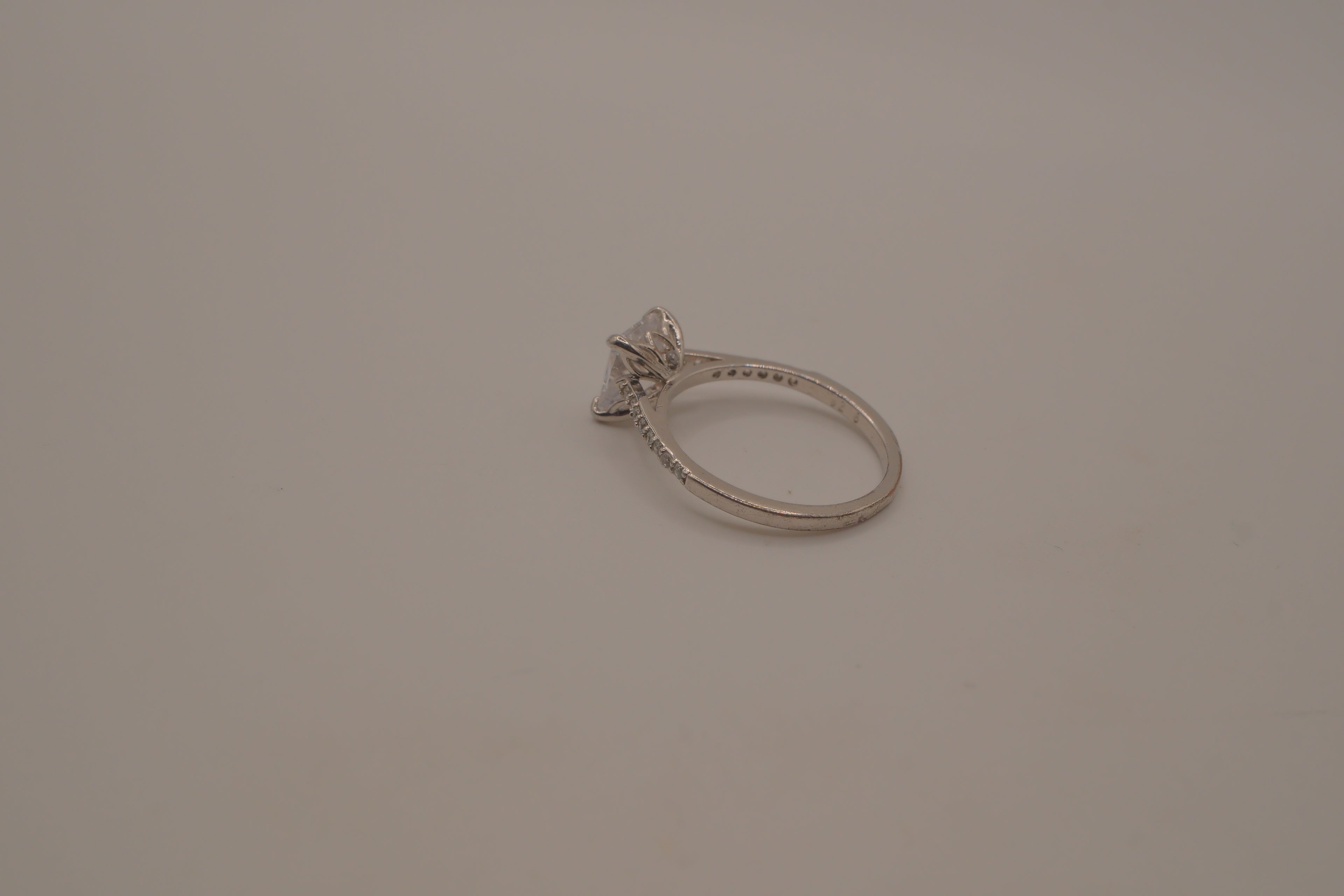 Sterling silver classic solitaire ring with a pavé-set band