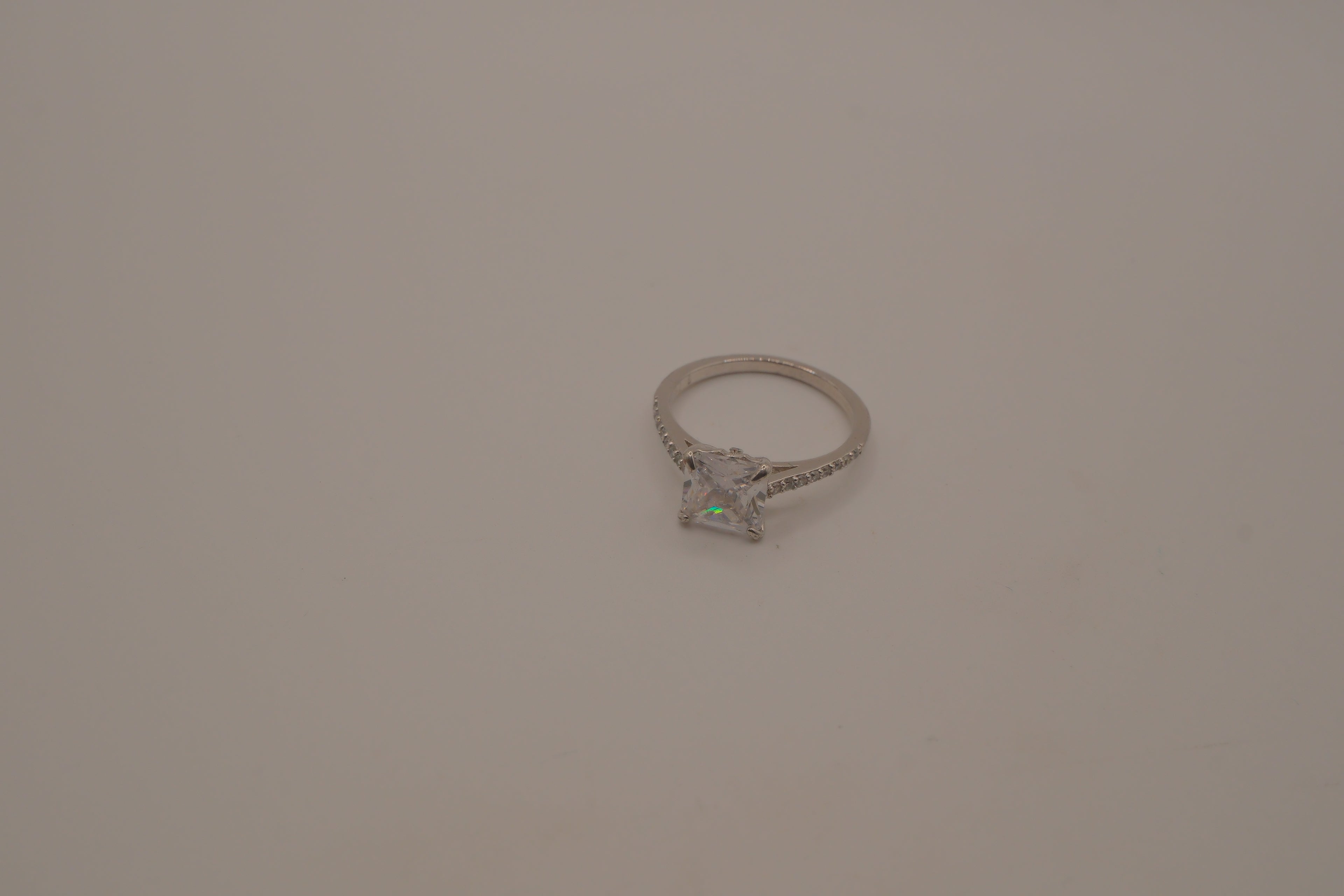 Sterling silver classic solitaire ring with a pavé-set band