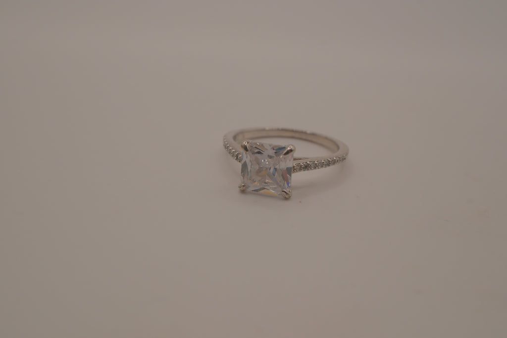 Sterling silver classic solitaire ring with a pavé-set band