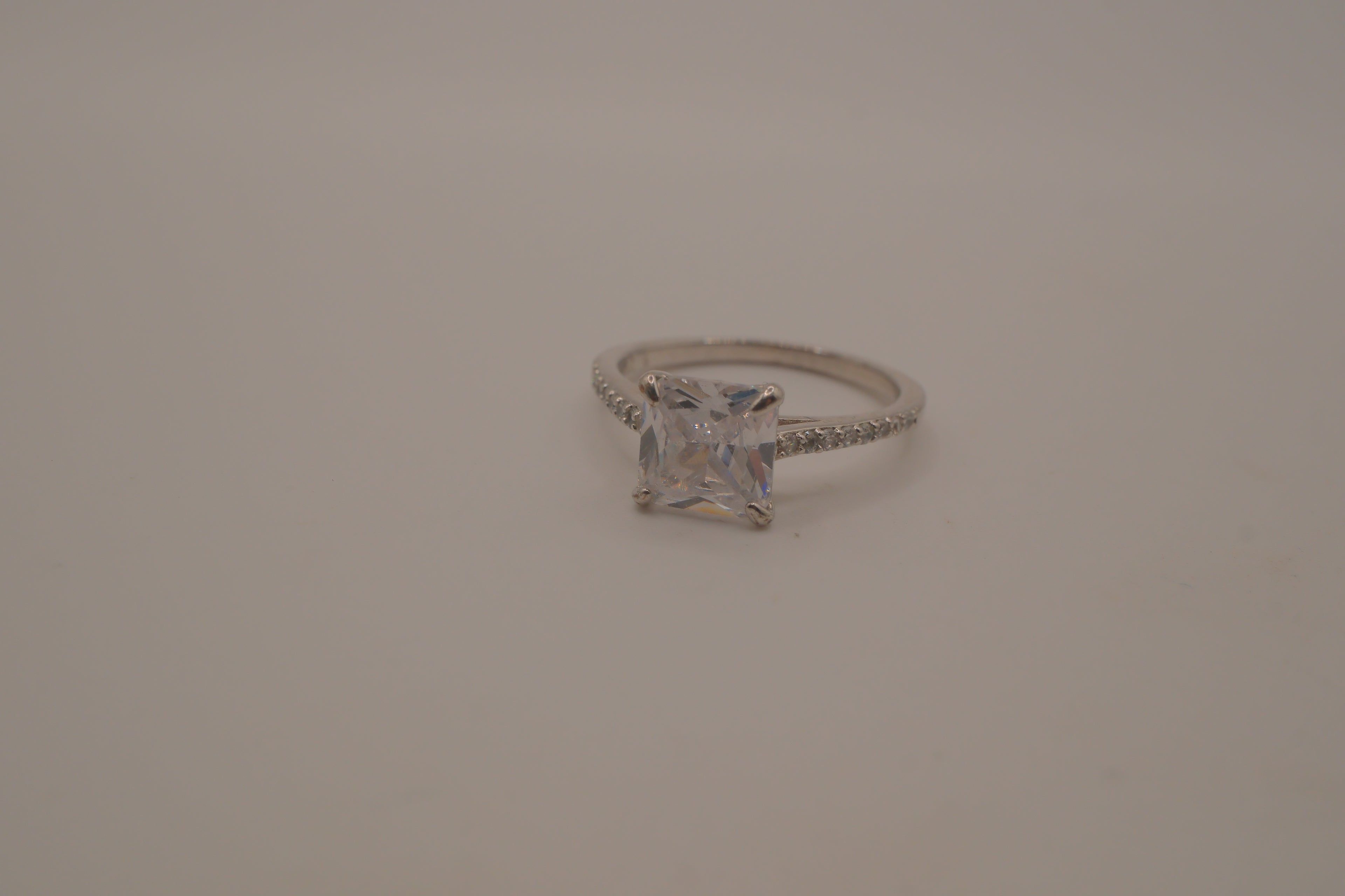 Sterling silver classic solitaire ring with a pavé-set band