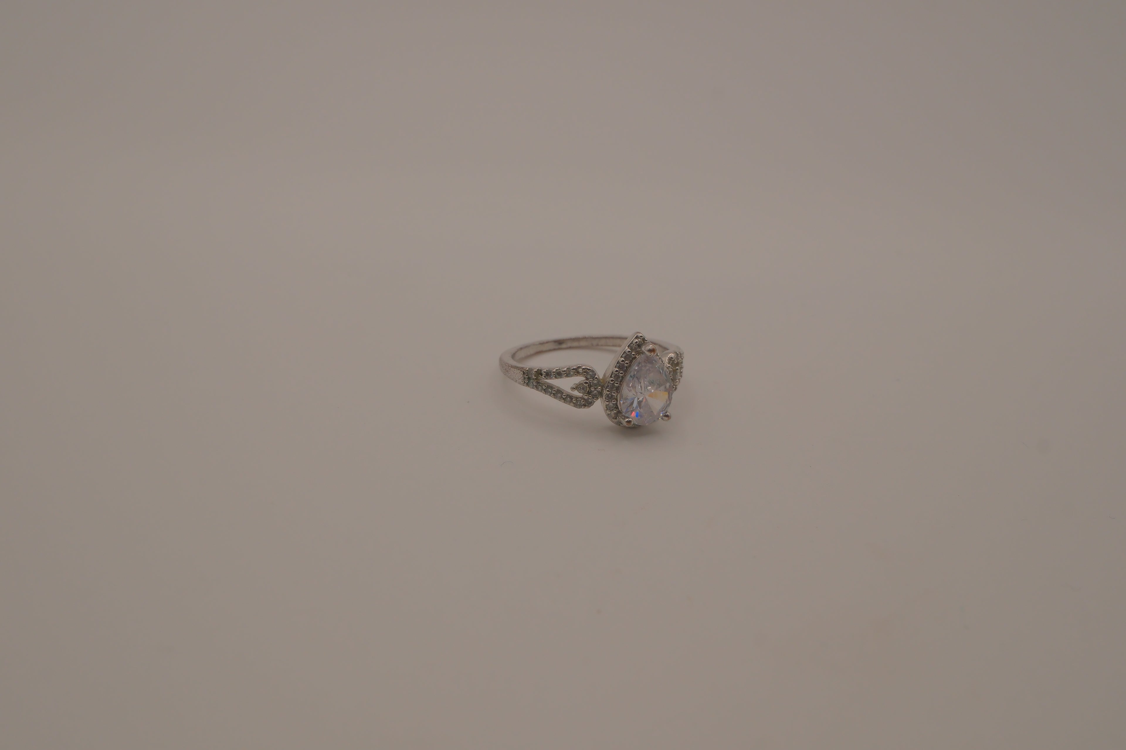Sterling silver pear-shaped halo ring