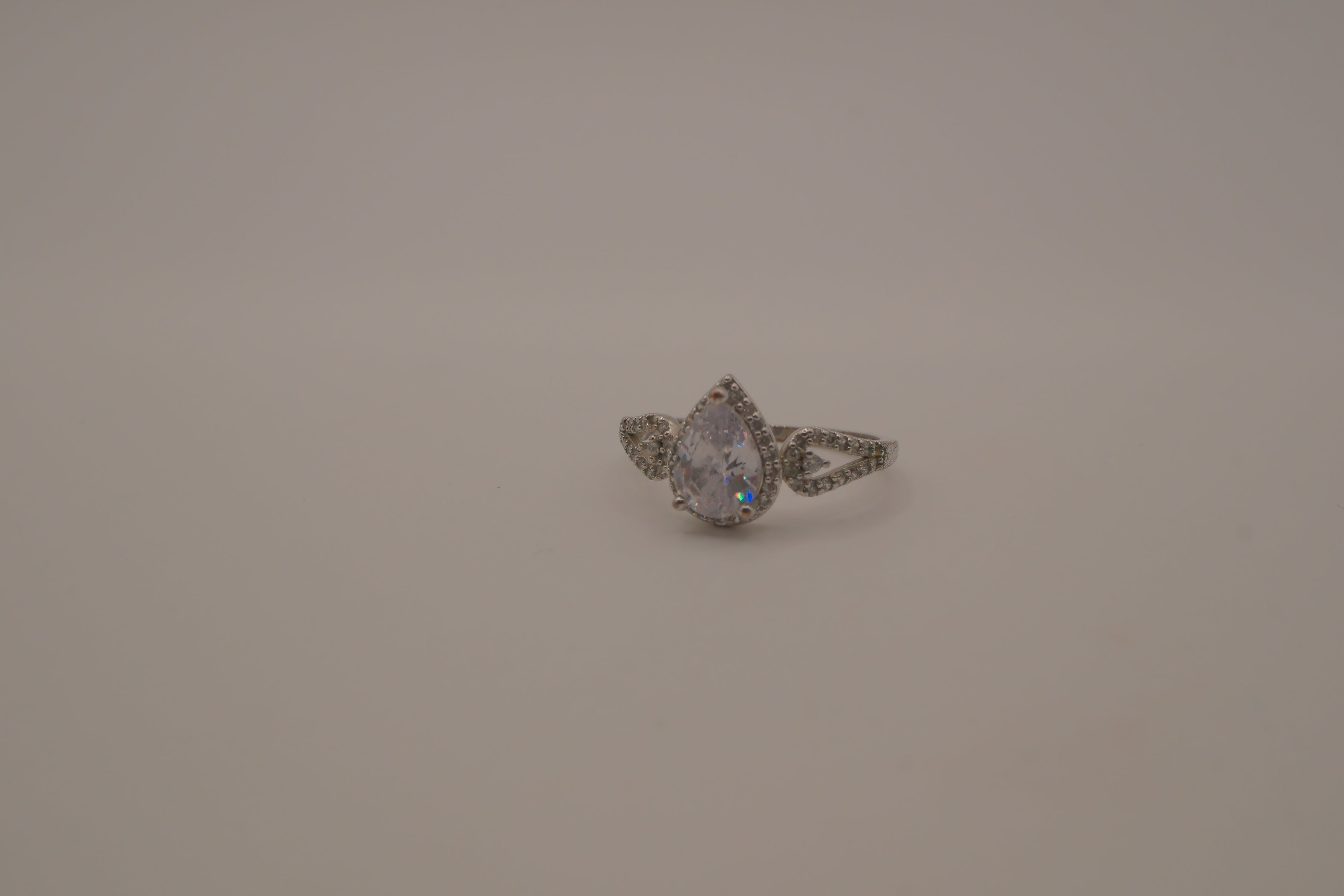 Sterling silver pear-shaped halo ring