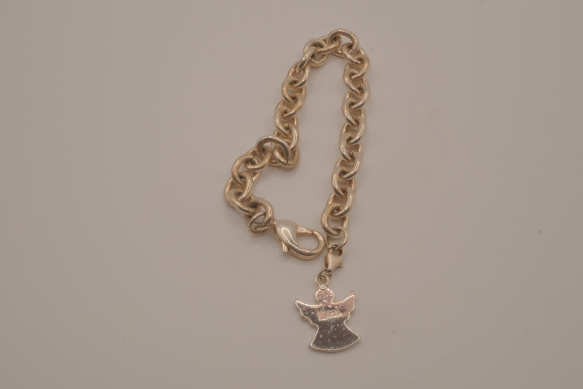 Sterling silver charm bracelet with an angel pendant