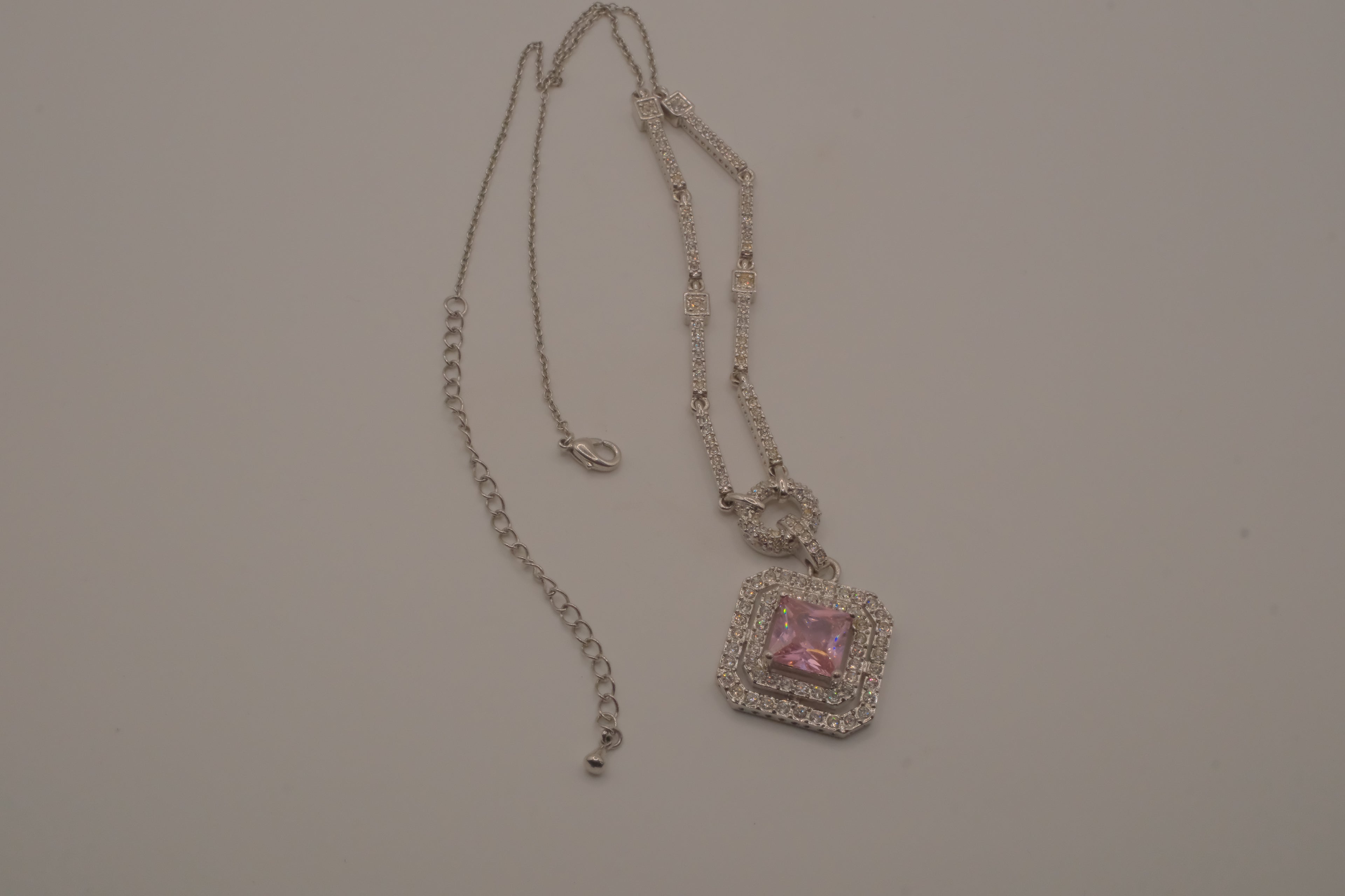 Silver tone Pink stone halo pendant necklace