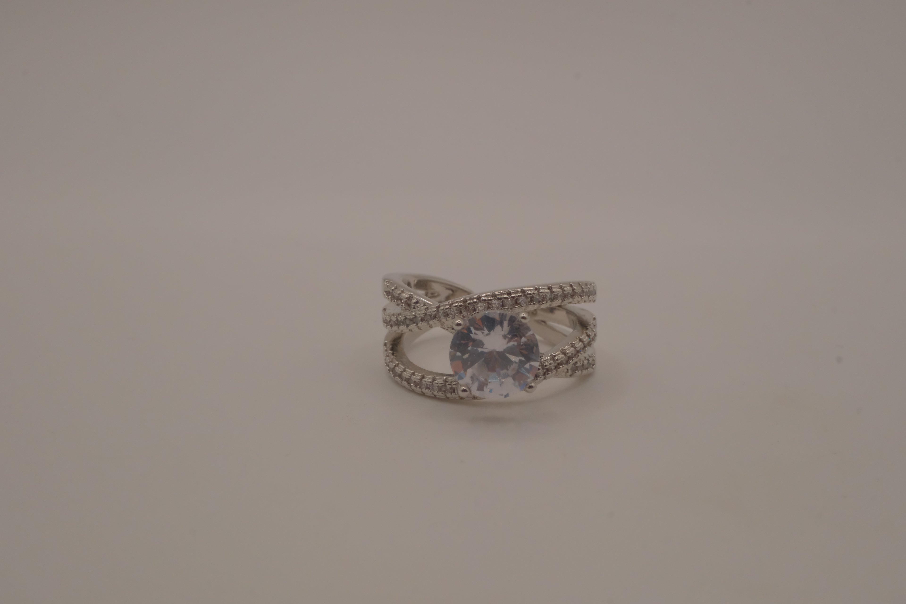 Sterling silver criss-cross crossover solitaire ring