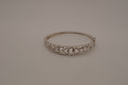 Sterling silver interlocking heart pattern hinged bangle bracelet