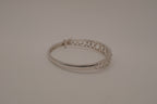 Sterling silver interlocking heart pattern hinged bangle bracelet