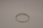 Sterling silver interlocking heart pattern hinged bangle bracelet