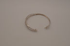Sterling silver interlocking heart pattern hinged bangle bracelet