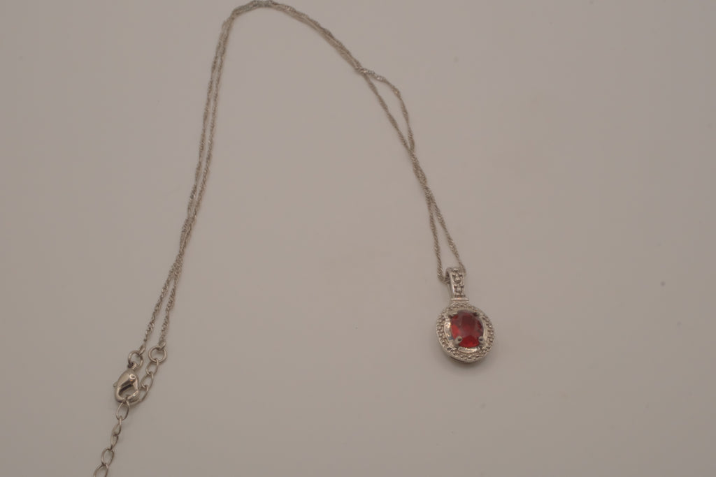 Oval-cut red gemstone halo pendant necklace
