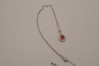 Oval-cut red gemstone halo pendant necklace