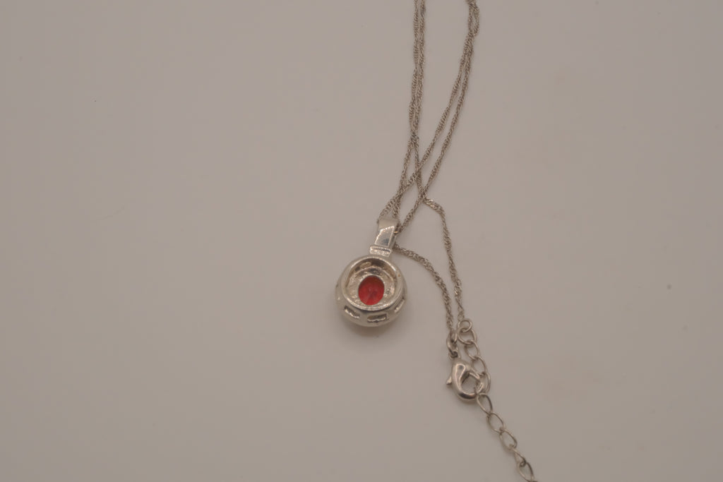 Oval-cut red gemstone halo pendant necklace