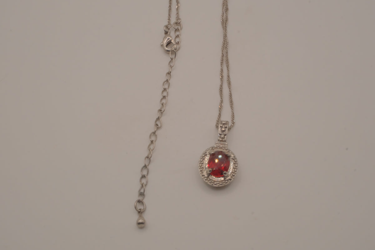 Oval-cut red gemstone halo pendant necklace