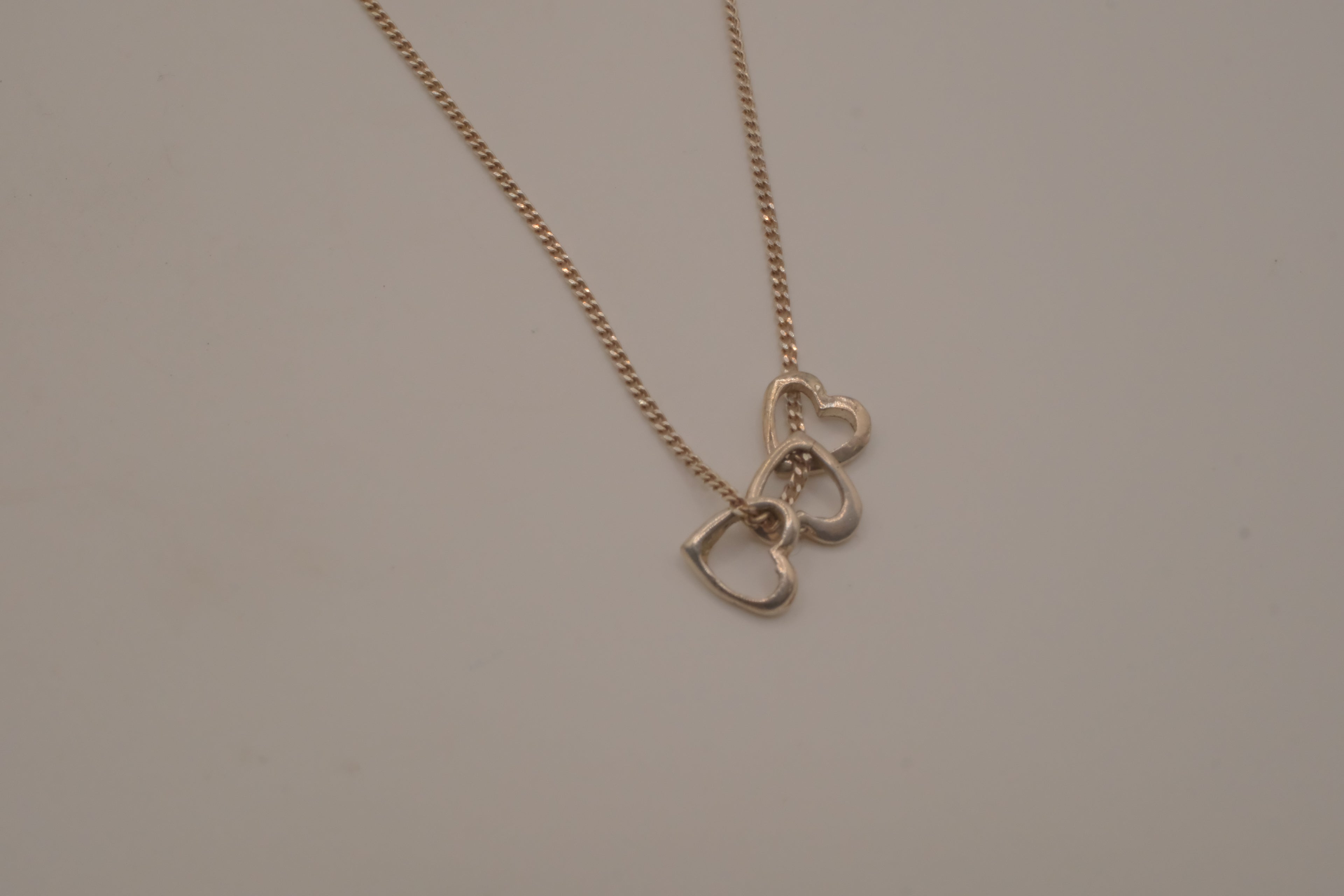 Sterling silver triple heart pendant necklace