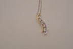 Sterling silver two tone journey-style pendant necklace